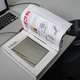 Illustration for article titled Strange Device Adds Tactile Feedback to Ebooks